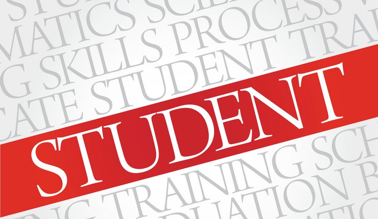 Das Bild zeigt einen weißen Schrifzug Student vor einem roten Hintergrund. Foto: Colourbox