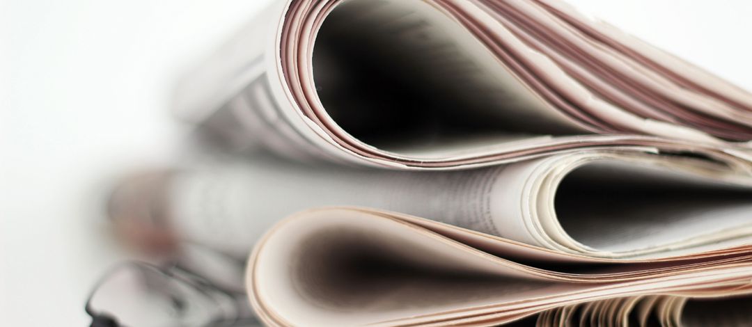 Stack of folded newspapers