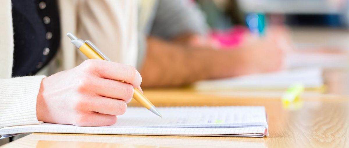 enlarge the image: Students writing an exam