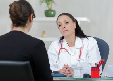 Female doctor talking to a patient.